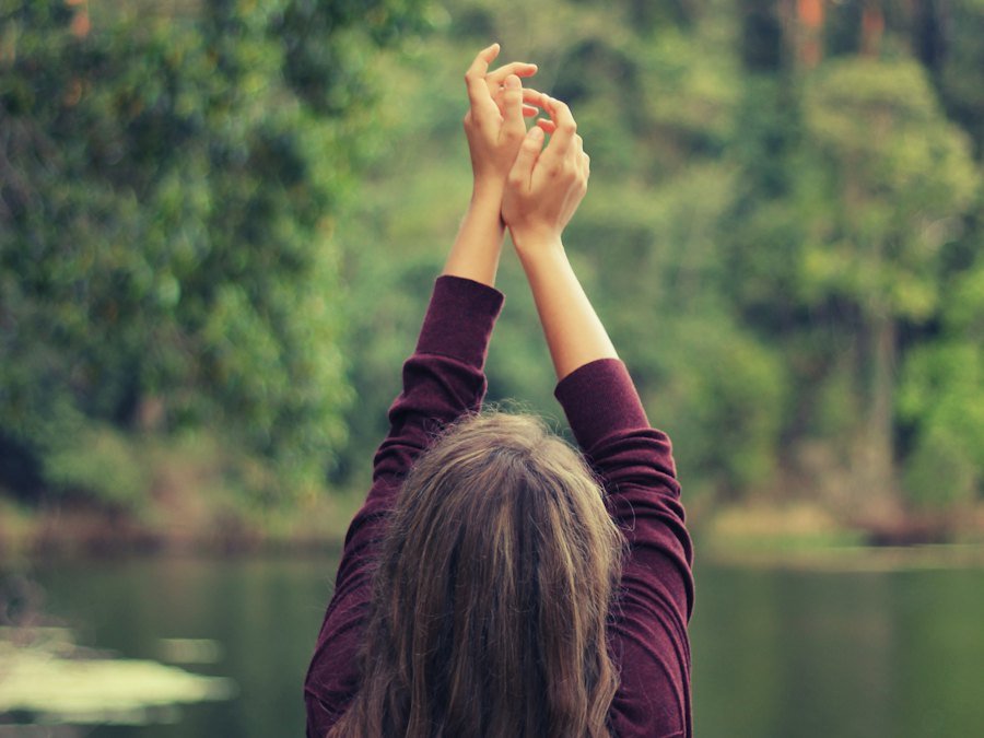Person calmly looking over a lake
