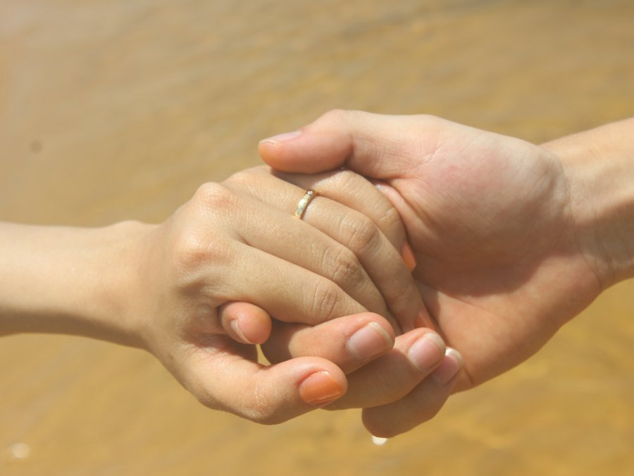 Couple holding hands