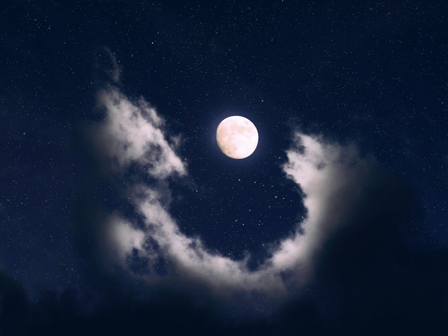 Crescent moon among clouds